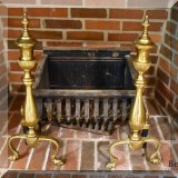 D18. Brass andirons (23&rdquo;h) and iron fire grate. 